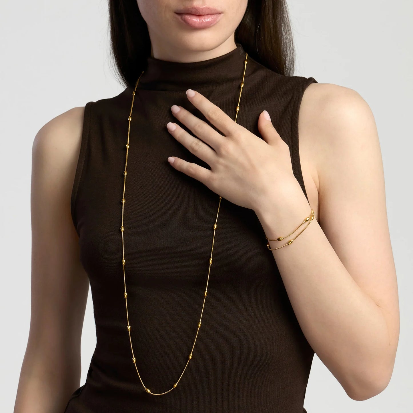 KIDULT - Bracciale in acciaio dorato con catene snake ed elementi ovali